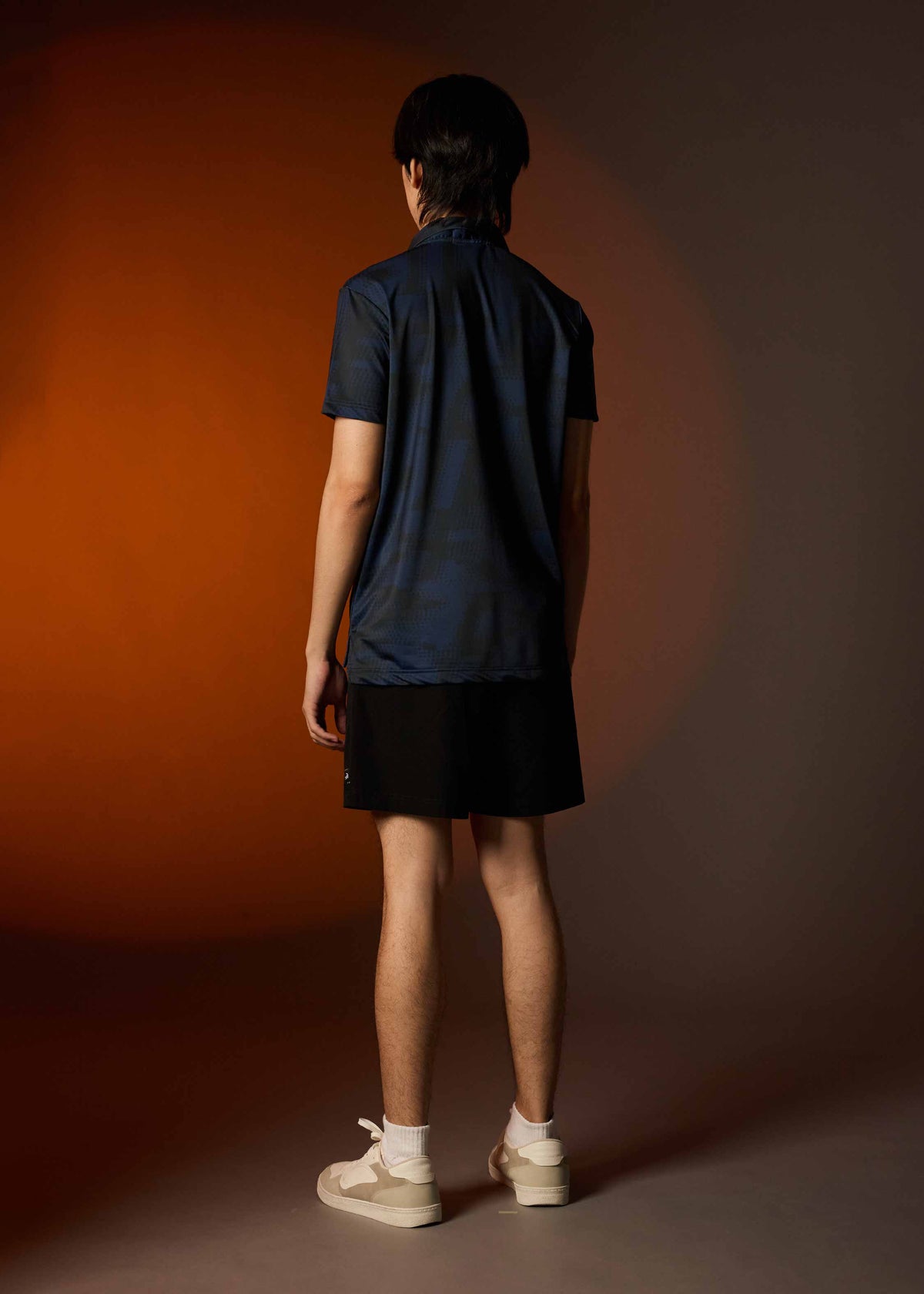 เสื้อโปโลทรงคัสตอมฟิตสีกรมพิมพ์ลาย