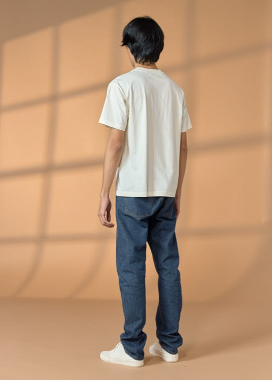 เสื้อยืดคอกลมแขนสั้นสีอันบลีซคอตต้อมทรงโอเวอร์ไซส์ฟิตพร้อมลายกราฟฟิก